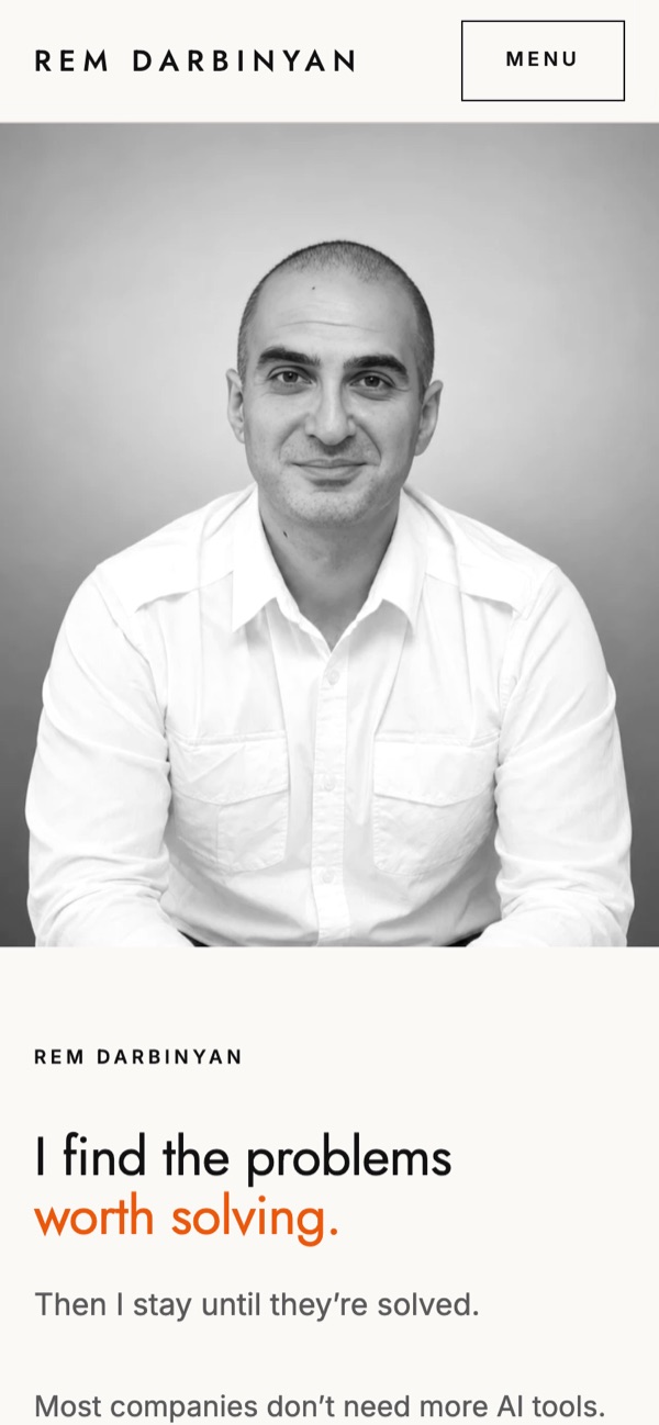 rem.am homepage on a phone, with the black-and-white portrait above the headline